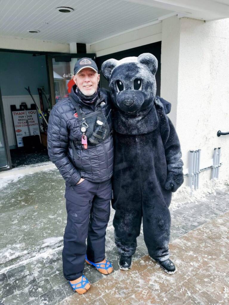 Matthew Erickson with a Black Bear mascot
